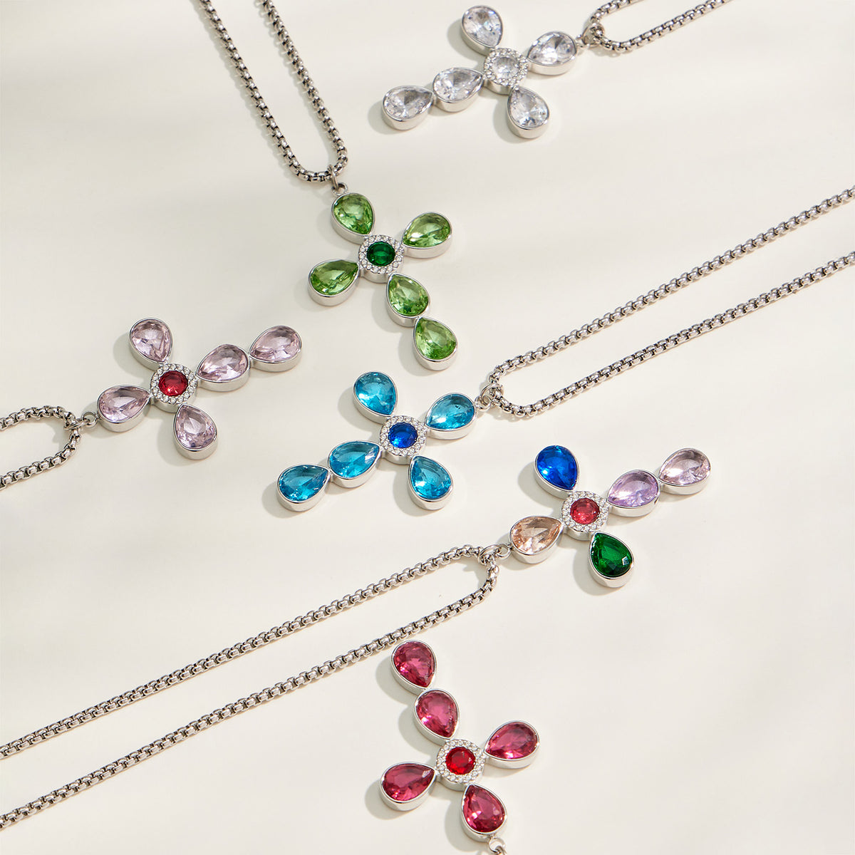 Steel-tone cross necklaces with colorful faceted stone pendants