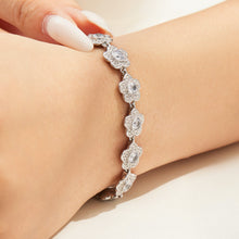 Steel-tone cubic zirconia flower bracelet in stainless steel worn on wrist