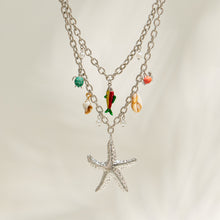 Steel tone sea life charm necklace with starfish pendant and colorful ocean details