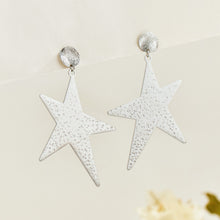 Pair of steel-tone stainless steel star drop earrings with textured five-point star design