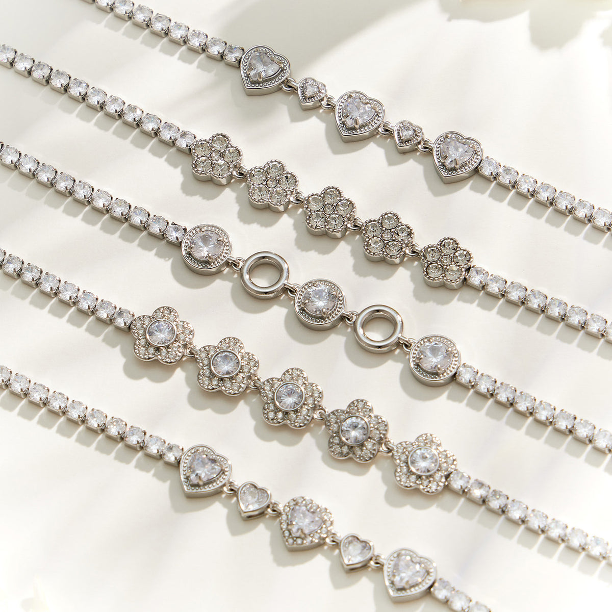 Steel zircon chain bracelets flat lay