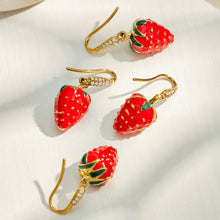 Red strawberry cubic zirconia drop earrings displayed on a light background