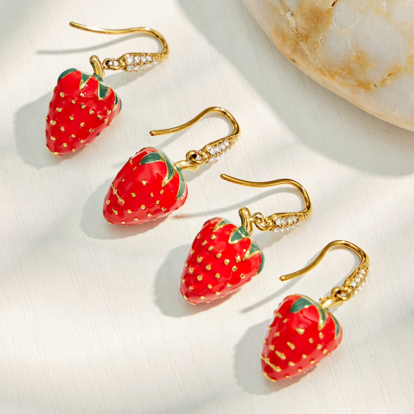 Strawberry cubic zirconia earrings with red enamel and green leaf details