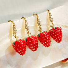 Multiple pairs of red strawberry drop earrings with gold-tone details