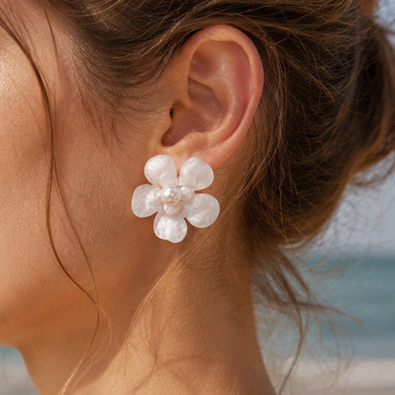 Summer style white pearl flower stud earrings worn on ear