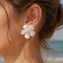 Summer style white pearl flower stud earrings worn on ear