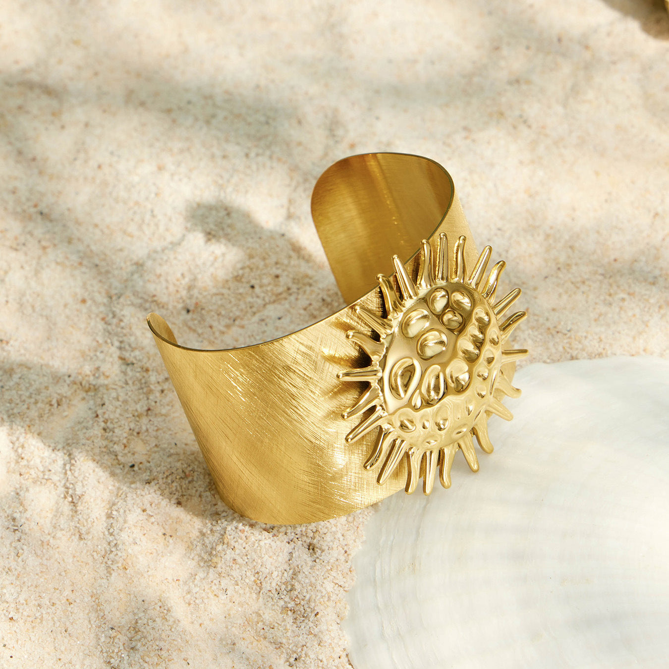Gold sun bangle with a mirror finish