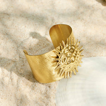 Gold sun bangle with a mirror finish