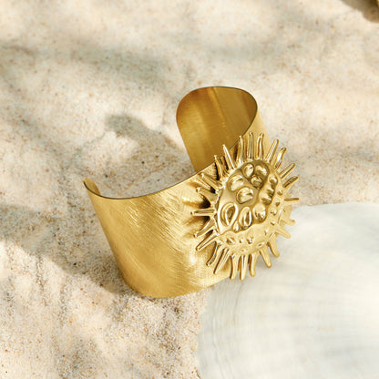 Gold sun bangle with a mirror finish