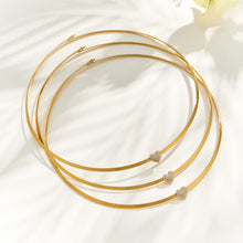 Close-up of the 18K PVD gold finished tassel necklace