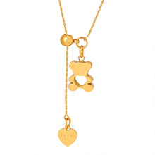 Gold-tone teddy bear pendant necklace in stainless steel with hollow bear design, adjustable drop and heart charm