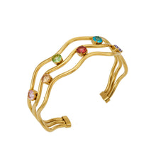 Three-layer cubic zirconia open bangle in gold-tone 316L stainless steel
