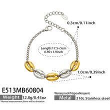 Two-tone steel and gold cowrie shell link bracelet size and product detail guide