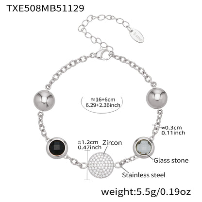 Silver stainless steel bracelet featuring black and clear glass stones with zircon center
