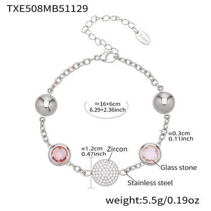 Stainless steel silver bracelet featuring pink cubic zirconia and glass stone details with adjustable chain
