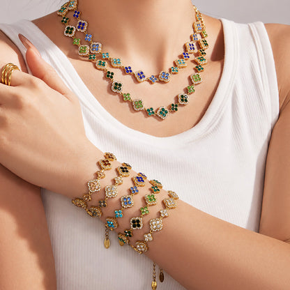 18K gold PVD zircon four leaf clover jewelry set with necklace and bracelets on model