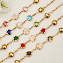 A stylish arrangement of hypoallergenic bezel-set gemstone bracelets and matching drop earrings for women.