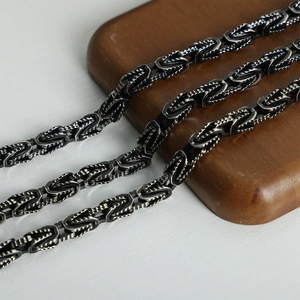 Vintage black stainless steel bracelet displayed for men’s streetwear jewelry and boutique collections