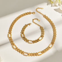 Gold watch band chain necklace and matching bracelet flat lay