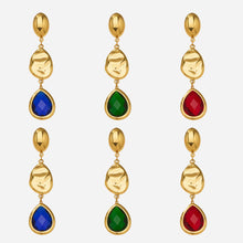 Wholesale 316L stainless steel 18K PVD gold plated Czech crystal water drop hypoallergenic earrings in blue, green, and red.