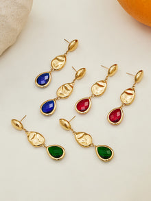 Flat lay of tarnish-free 18K gold plated stainless steel Czech glass pendant earrings for jewelry wholesale.
