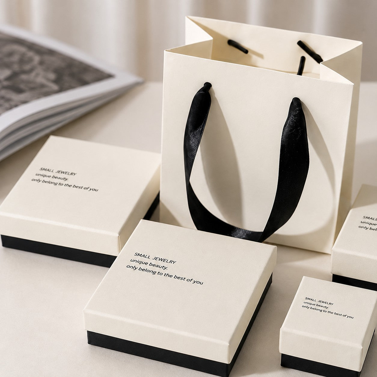 White and black jewelry boxes with matching paper gift bag for wholesale boutique packaging