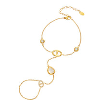Gold-tone 316L stainless steel double-finger hand chain bracelet with white cat eye stones