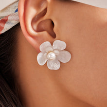earrings-on-ear-close-up.jpg
White pearl flower stud earrings worn on ear close up