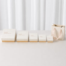 White and pink jewelry packaging boxes arranged by size for different jewelry types and wholesale sourcing