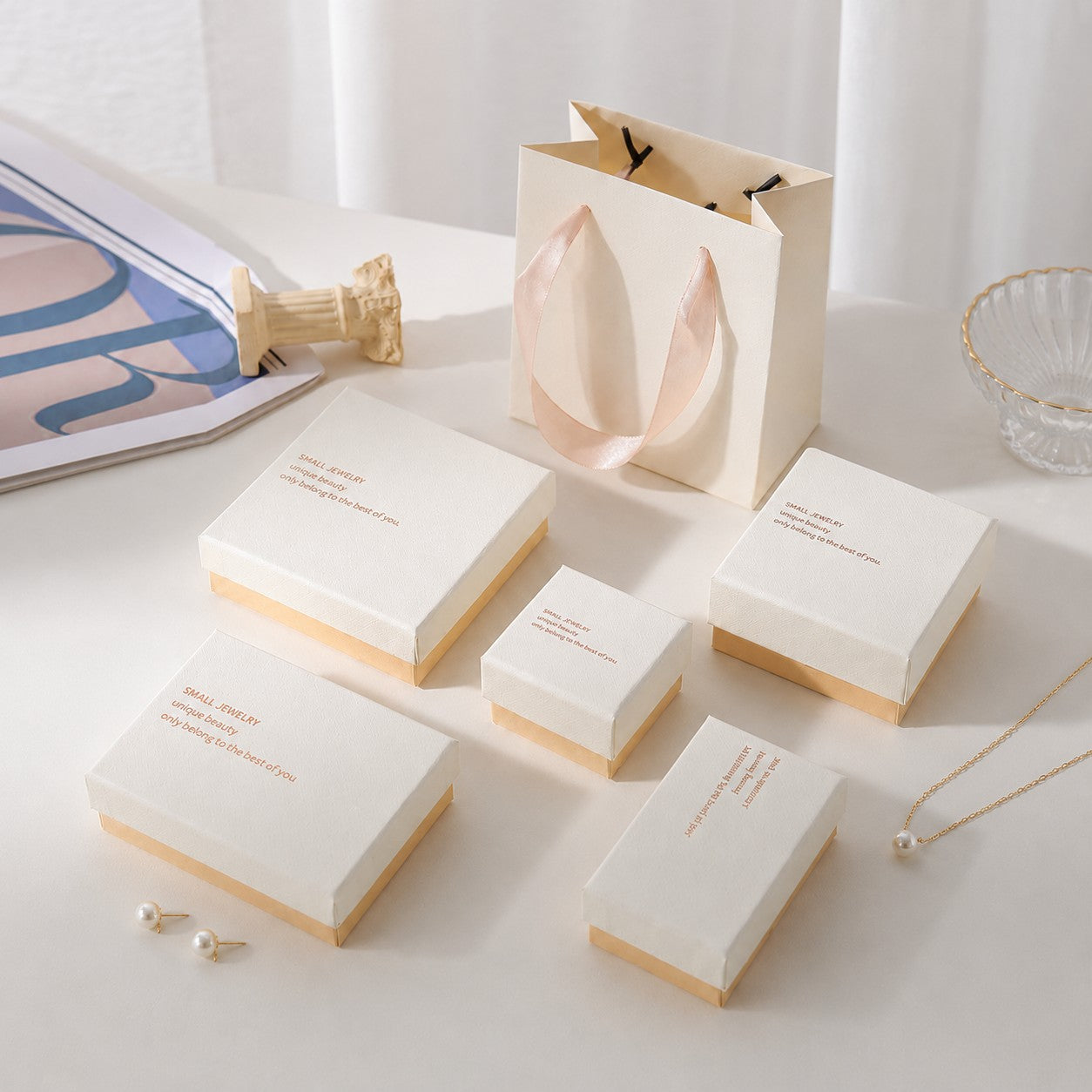 White and pink jewelry gift boxes arranged in multiple sizes for retail and wholesale jewelry packaging