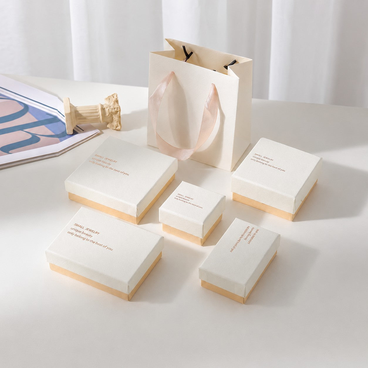 White and blush pink jewelry packaging boxes in multiple sizes for rings earrings bracelets and necklaces