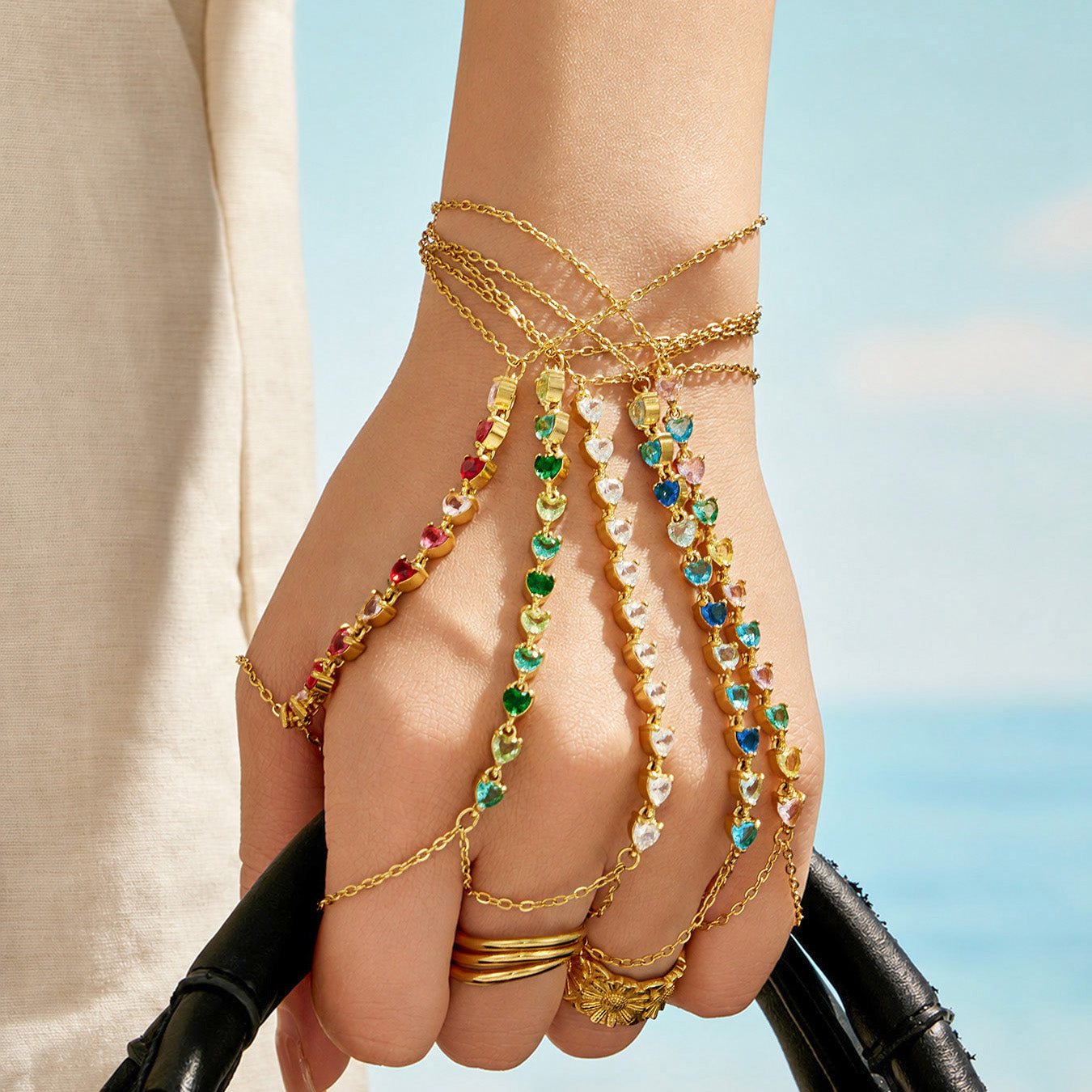 Wrist-to-finger hand chain bracelet design with adjustable finger loop detail