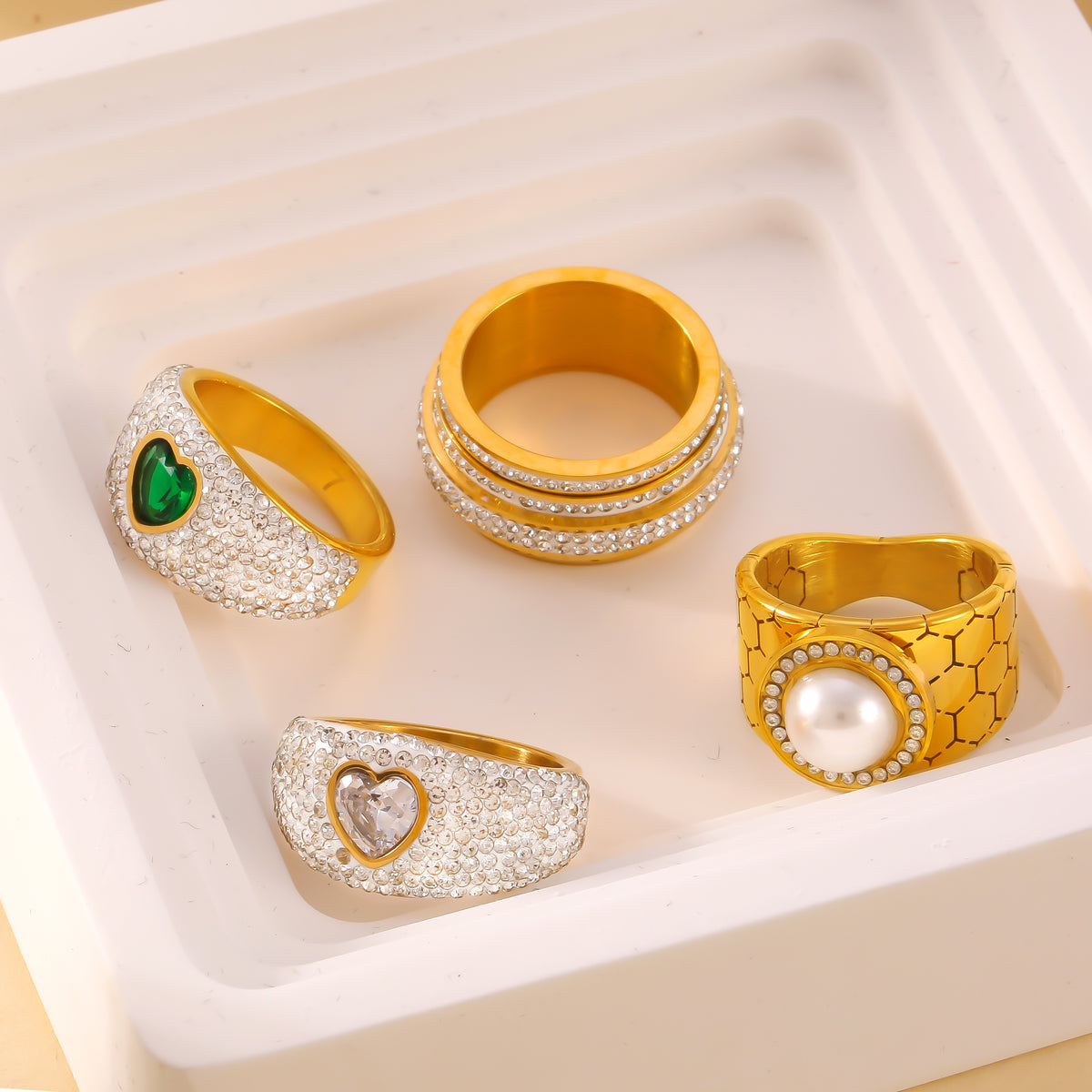 Zircon and pearl statement rings flat lay