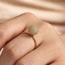 Gold zircon ball open ring worn on finger with pavé round stone detail