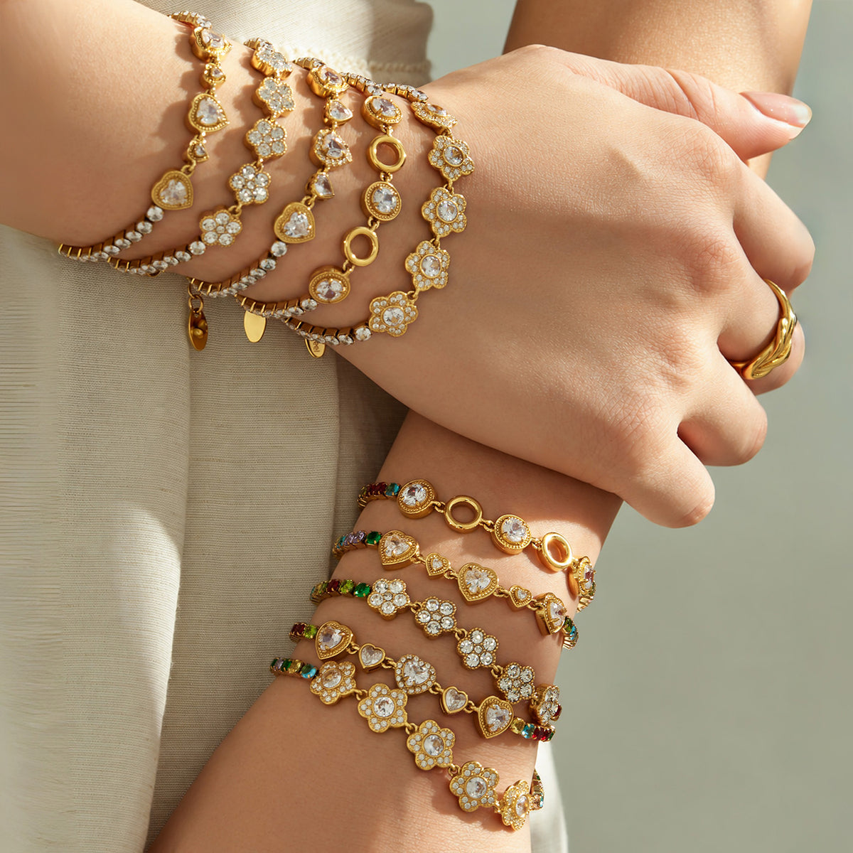 Zircon bracelets stacked on both wrists