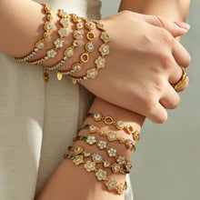 Zircon bracelets stacked on both wrists