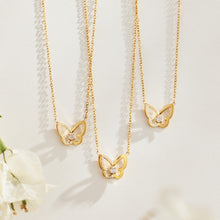 Gold-tone zircon butterfly pendant necklaces displayed together on a light background