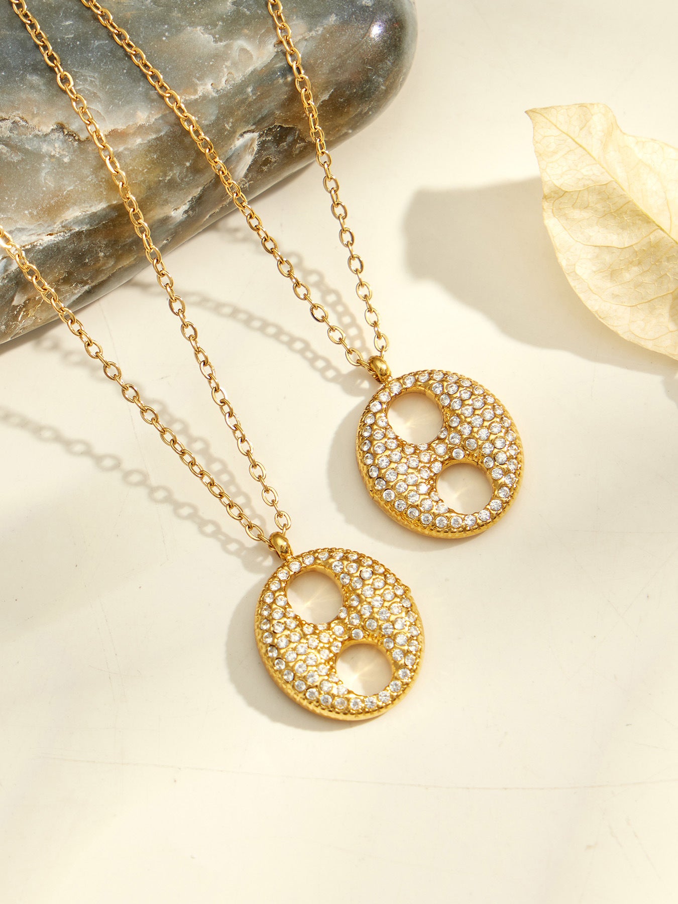 Close-up of the zircon pendant in 18K PVD gold finish