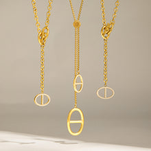 Gold zircon necklace designs showing long lariat and shorter toggle drop styles
