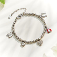 Steel finish multi charm bracelet with heart, horseshoe and colorful decorative charms