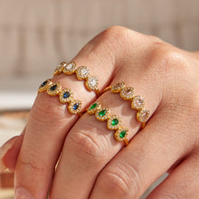 Colorful 5A zircon rings styled on hand with gold tone finish for boutique fashion jewelry displays
